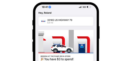Smartphone screen showing the Exxon Mobil Rewards app. The screen shows station details and rewards balance within the app.