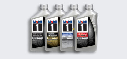 Four bottles of Mobil 1 diesel engine oil. From left to right, each bottle is labeled: Keep your engine running like new, extended performance, advanced clean, and high mileage.