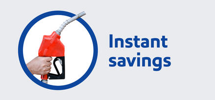 A hand holding a fuel pump nozzle with text: Instant savings