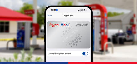 The Exxon Mobil Direct Debit+ card is set as the preferred payment method in an Apple Pay wallet on iPhone