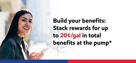 A woman smiling and holding her phone on a sunny day with text: Build your benefits: Stack rewards for up to 20¢/gal in total benefits at the pump*