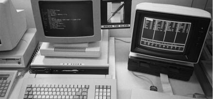 A black and white image of computers in the 1980s