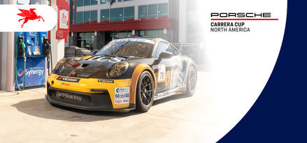 A Porsche race car at a Mobil branded fuel pump with text: Porsche Carrera Cup North America
